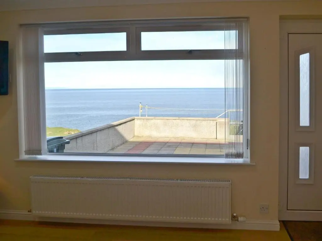 a large window with a view of the ocean at Dolphin View - Uk30689 in Portknockie