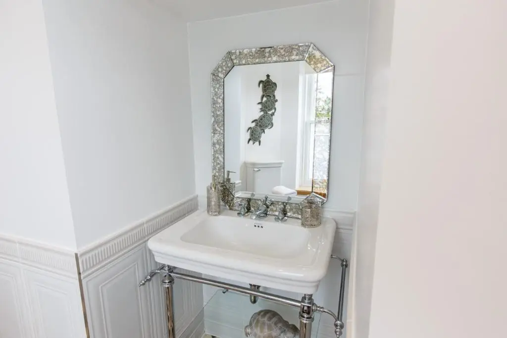 a bathroom with a sink and a mirror at St Andrews House in Ballater