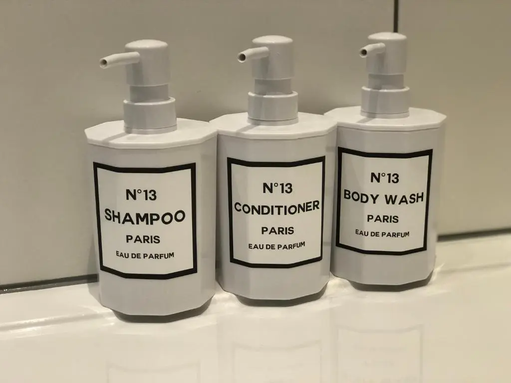 a group of three lotion bottles sitting on a counter at The Chalet in Inverness
