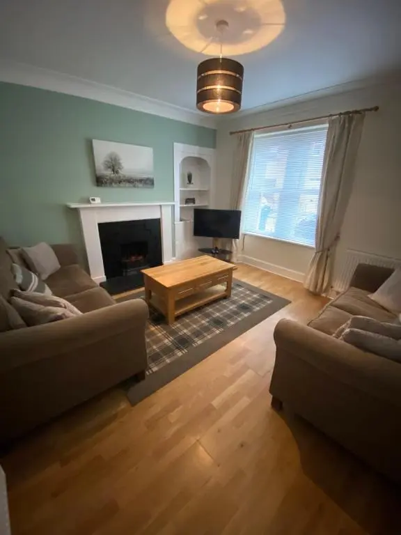a living room with two couches and a coffee table at No. 20 in Inverness