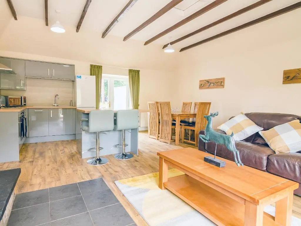 a living room with a couch and a table at Keepers Cottage - Uk30246 in Cray