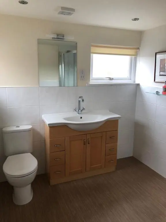 a bathroom with a toilet and a sink at The Aberdeen Arms Hotel in Tarves