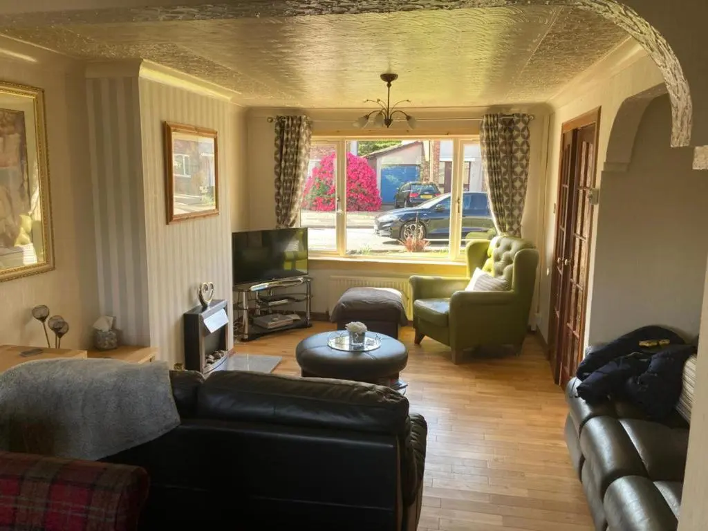 a living room with a couch and a tv at 3Bed House - Family Friendly - Close To LochNess in Inverness