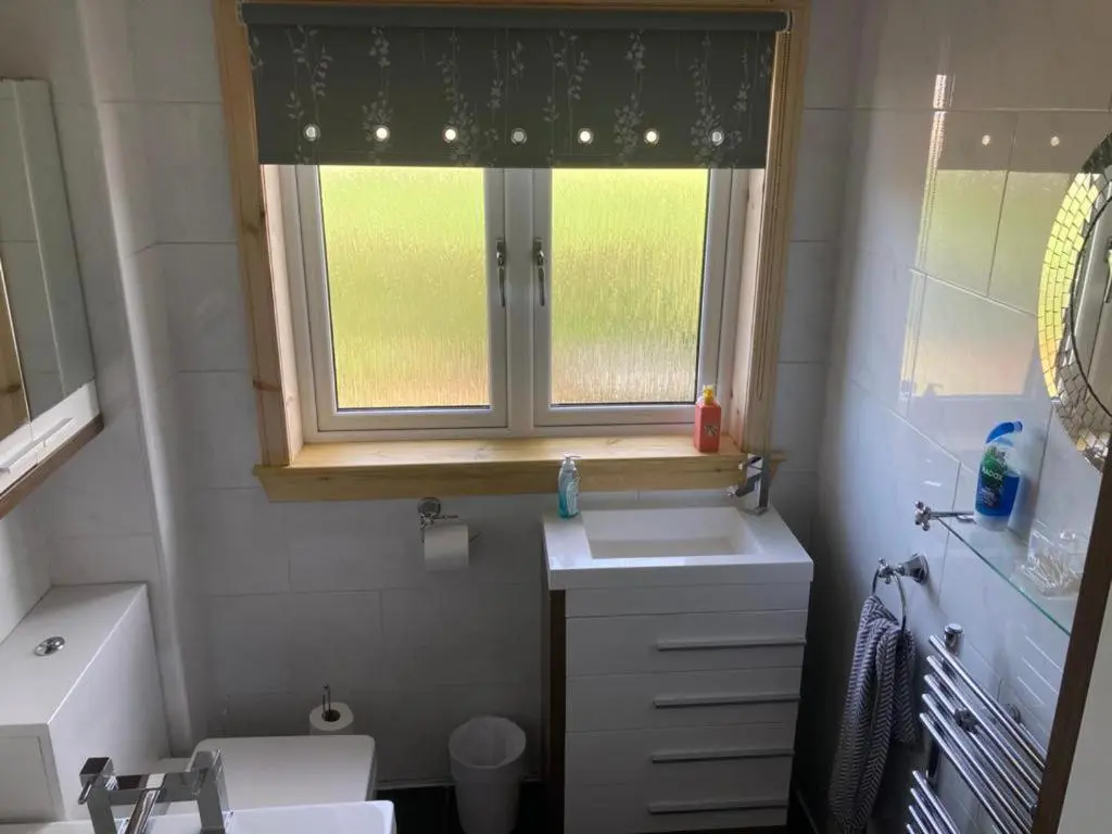 a small bathroom with a sink and a window at 3Bed House - Family Friendly - Close To LochNess in Inverness