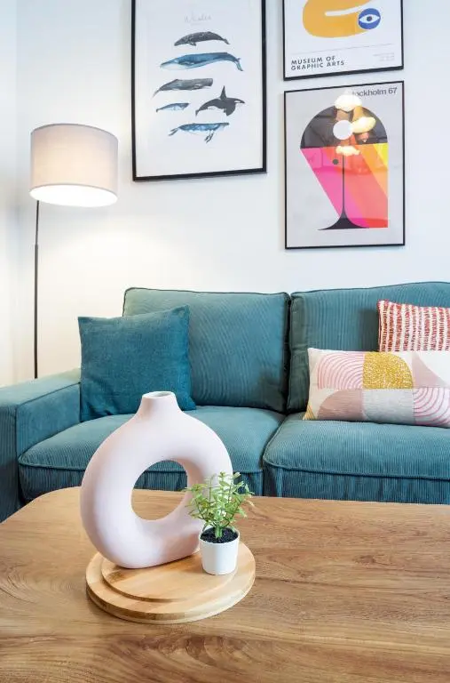 a living room with a couch and a table at Macdonald Street Snug in Inverness