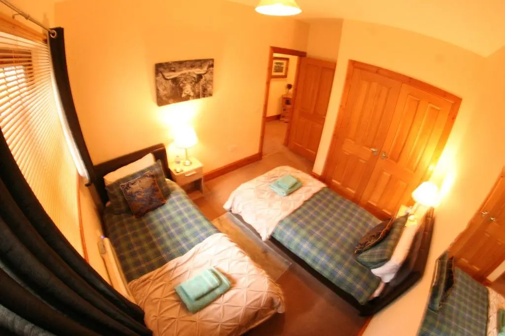 an overhead view of a bedroom with two beds at Talisker in Nairn