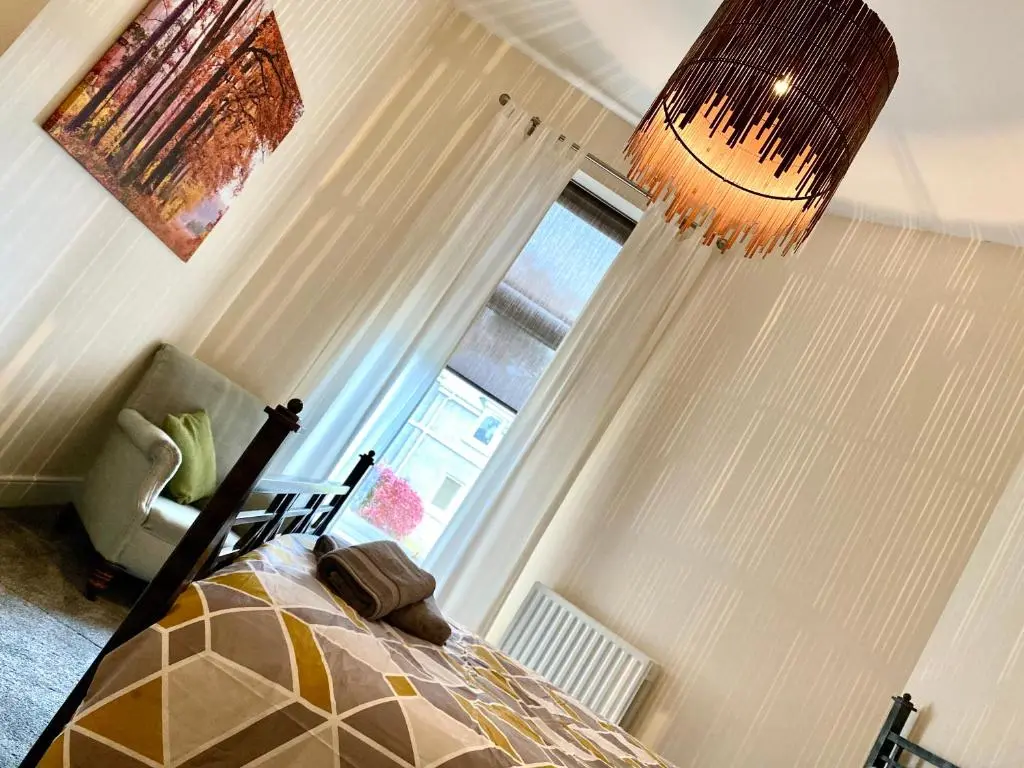 a bedroom with a bed and a window at Serviced Accommodation Moray Lesmurdie House, Elgin - Free Parking, Free WiFi in Elgin