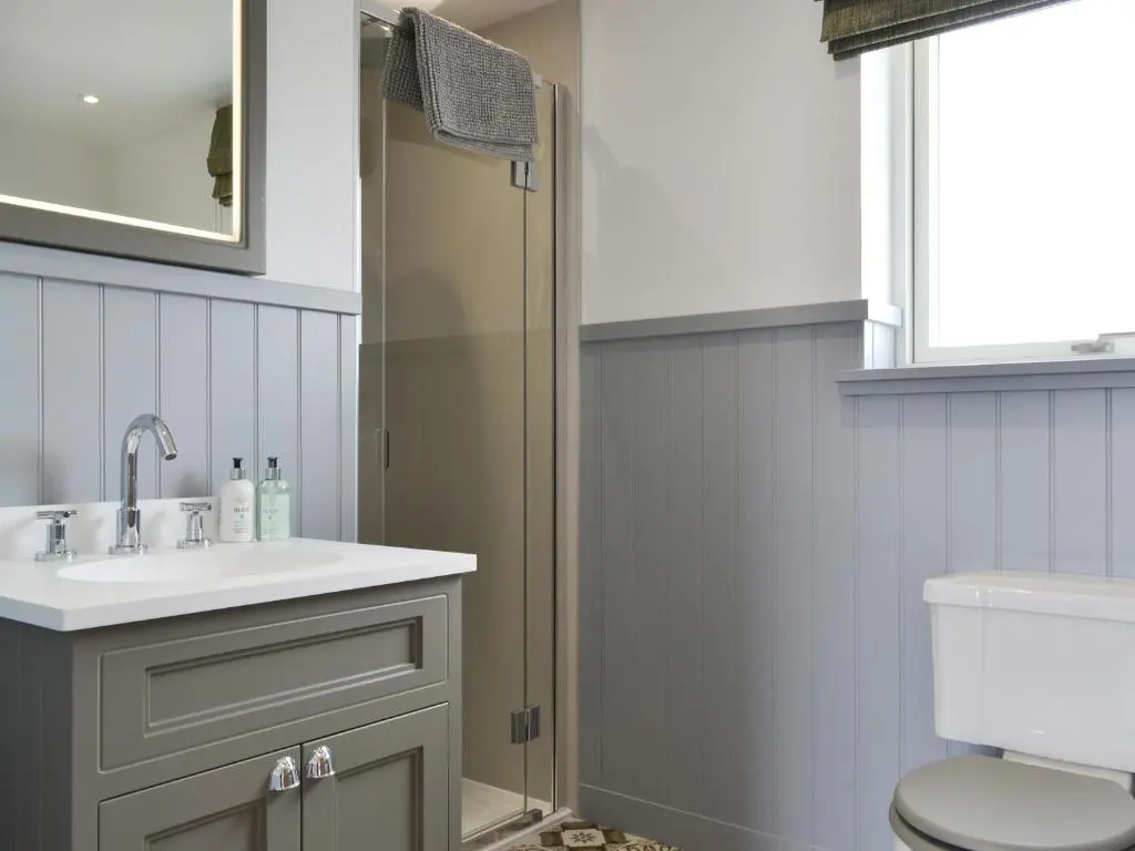a bathroom with a sink and a shower at Muirtown Lodge in Keith