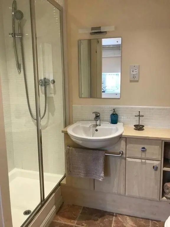 a bathroom with a sink and a shower at Tieveragh in Aviemore
