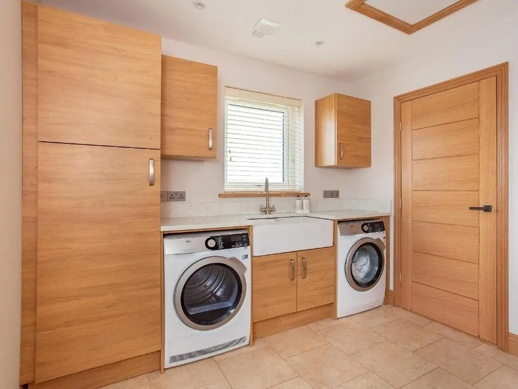 a laundry room with a washer and dryer at Morven View in Dunbeath