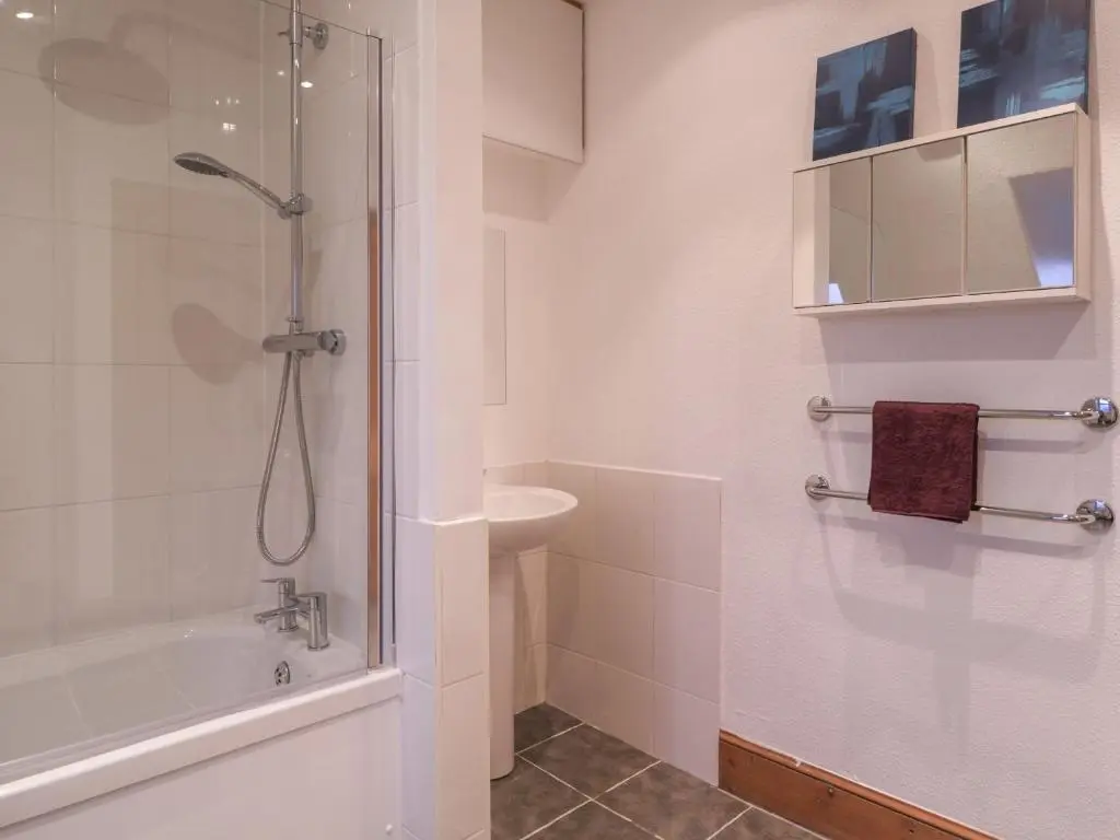 a bathroom with a shower and a sink at Kinnaird House in Grantown on Spey