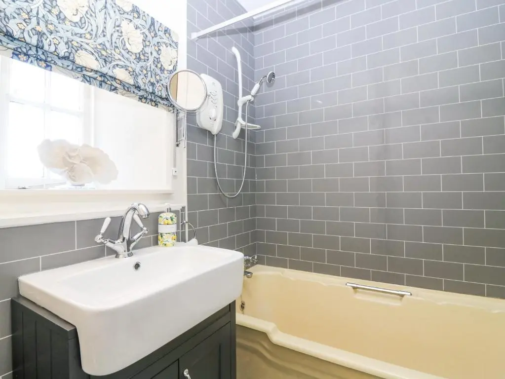 a bathroom with a sink and a bath tub at North Wing - Pitmedden Gardens in Ellon