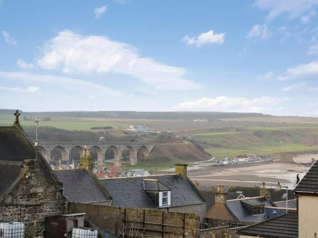 a view of a town with houses and a bridge at Brae Lodge in Cullen