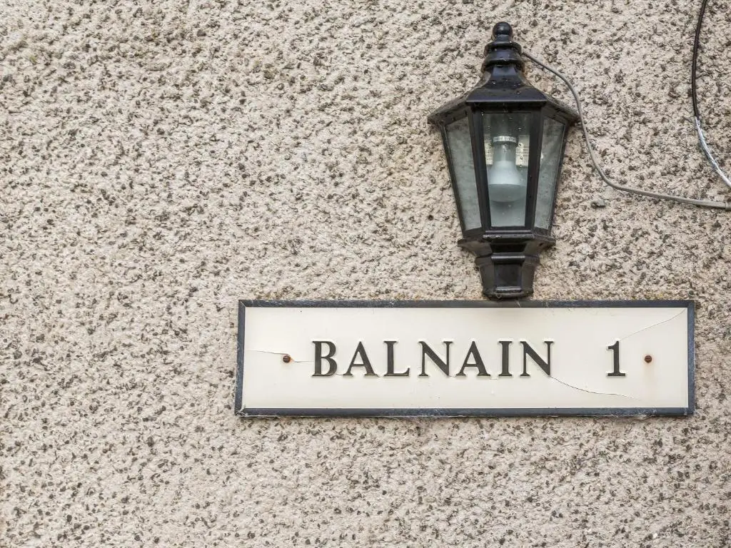 a street sign attached to a street light at Balnain 1 in Cononbridge