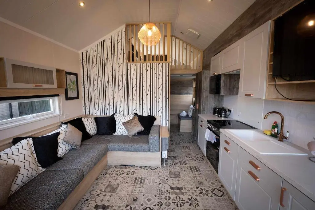 a living room with a couch in a kitchen at 2 Bed Inverness - Sleeps 4 - Parking - Wifi in Inverness