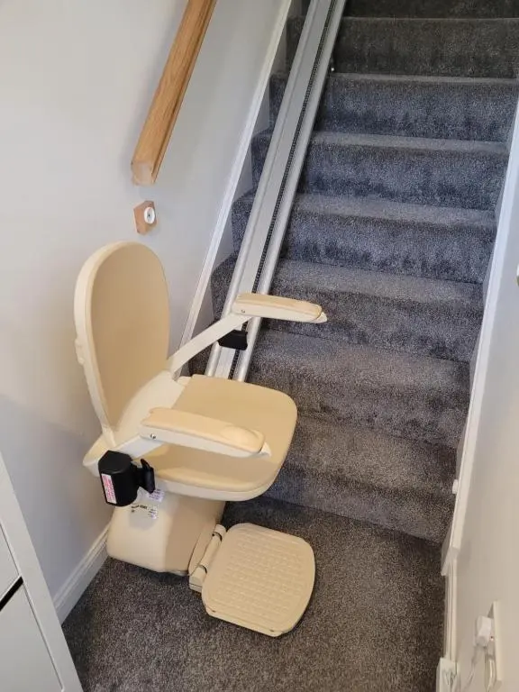 a toilet sitting on the floor in a room with stairs at Kellys in Inverness
