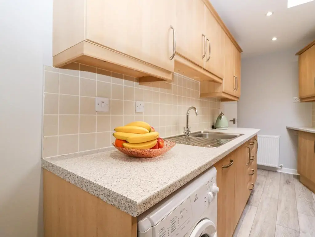 a kitchen with a bowl of bananas on a counter at Gairnlea House in Ballater