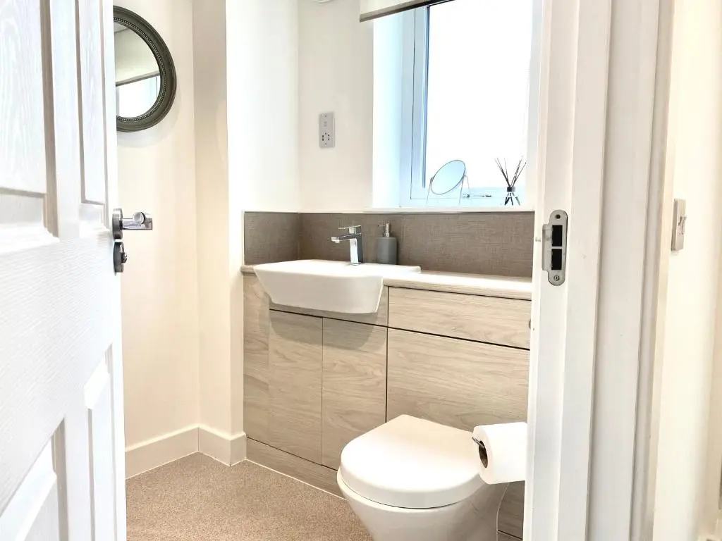 a bathroom with a white toilet and a sink at Serviced Accommodation Moray Cawdor Avenue, Elgin in Elgin