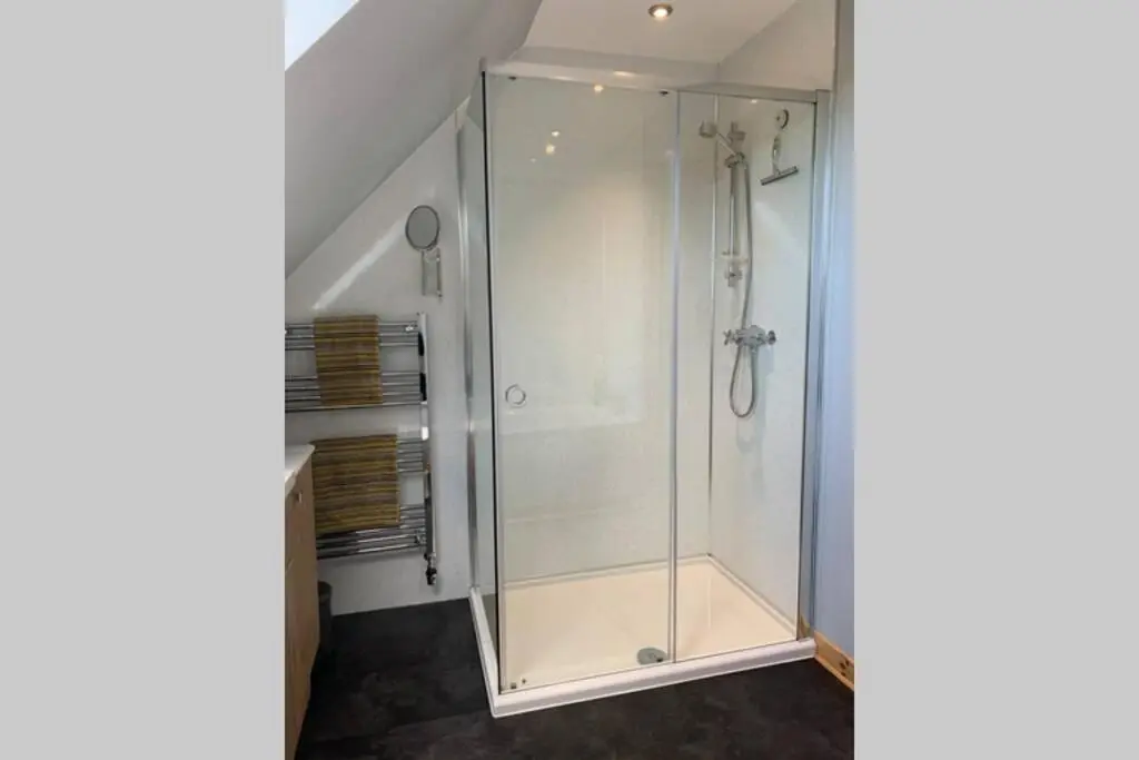 a shower with a glass door in a bathroom at The Nest - Near Inverness & Loch Ness in Inverness
