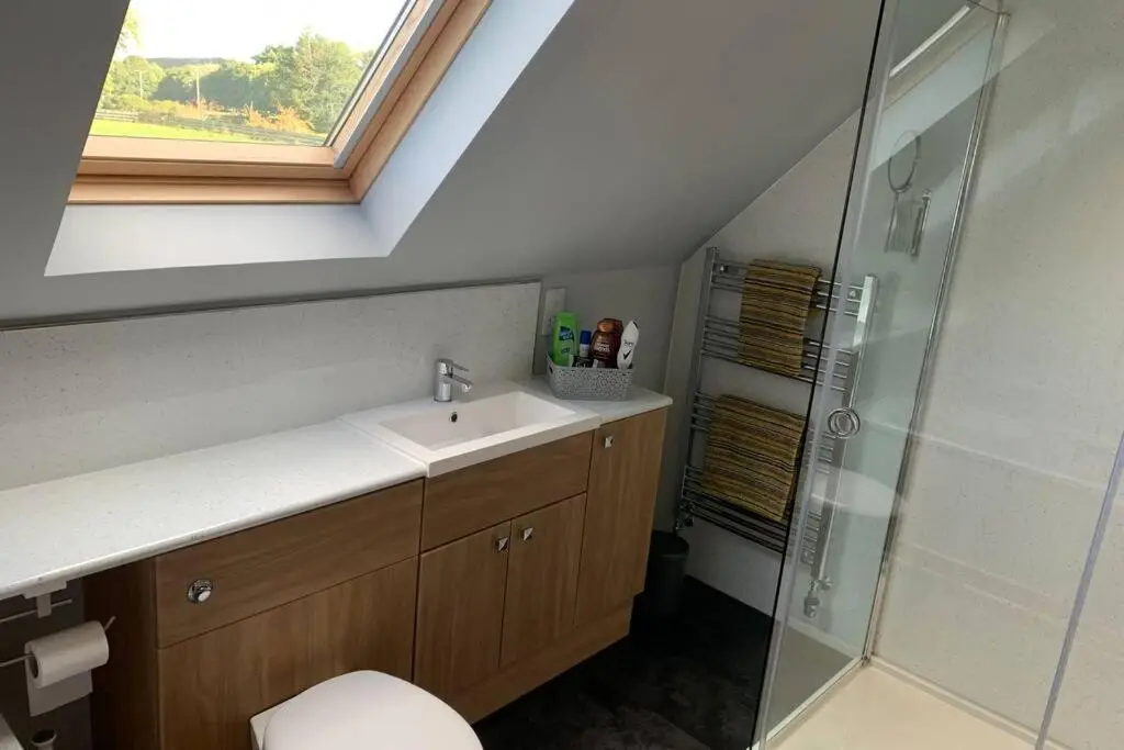 a bathroom with a sink and a shower at The Nest - Near Inverness & Loch Ness in Inverness