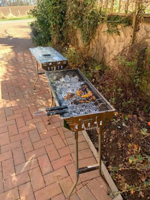 a bbq grill sitting on a brick patio at Immaculate Cabin 5 mins to Inverness Dog friendly in Inverness