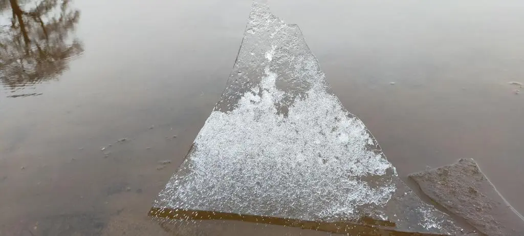 a pyramid in the middle of a puddle of water at Ardvonie House in Kingussie