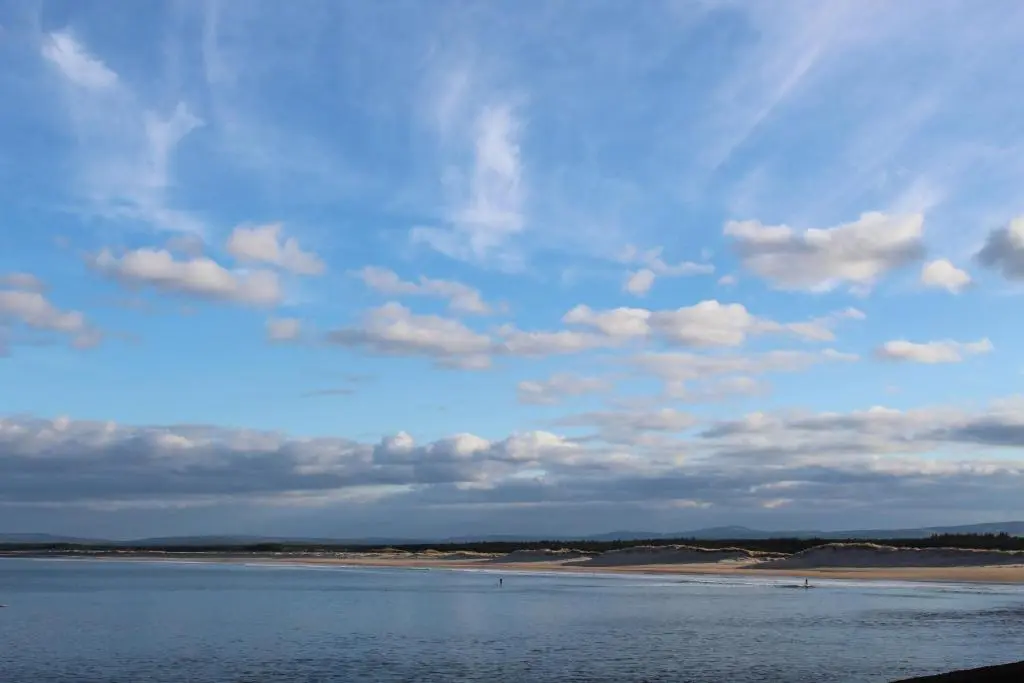a blue sky with clouds over a body of water at Beachfront Panoramic Seaview Free Wifi & Parking in Lossiemouth