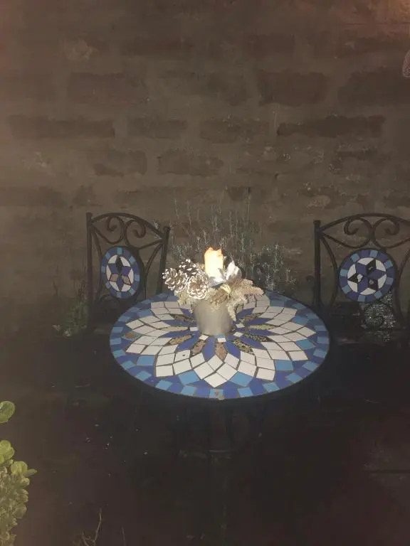 a table with a candle on top at Cavell House in Inverness