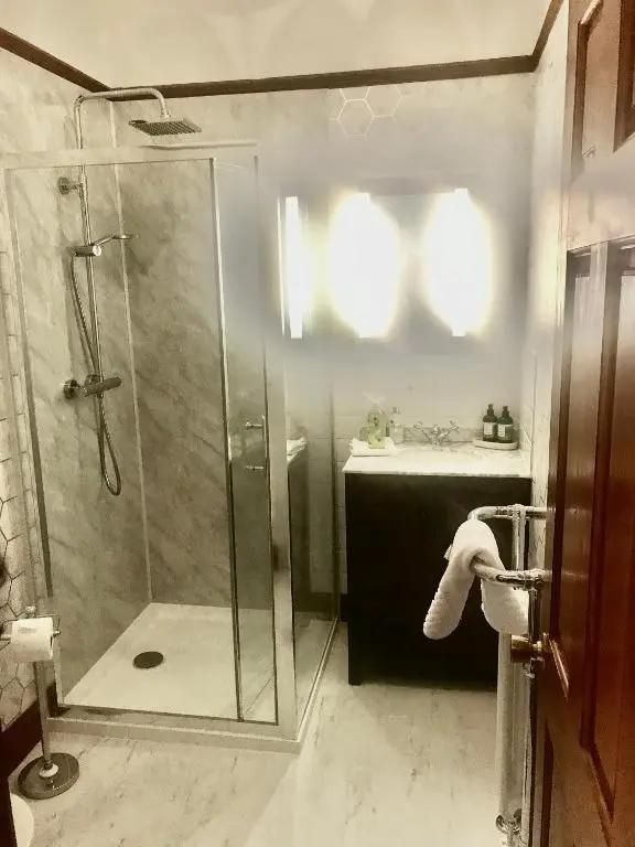 a bathroom with a shower and a sink at Cavell House in Inverness