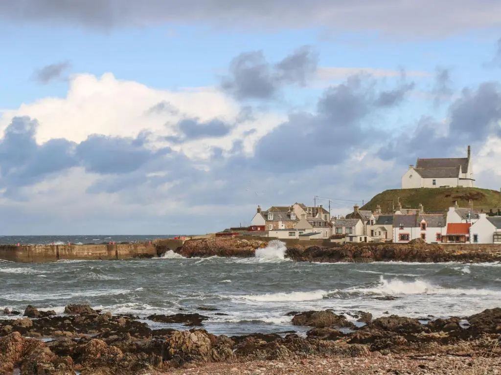 a group of houses on the shore of the ocean at Harbour View in Buckie