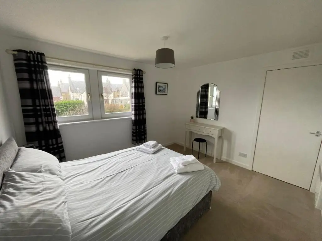 a bedroom with a bed and a window at Spacious 2 Bedroom Home in Picturesque Cullen in Cullen