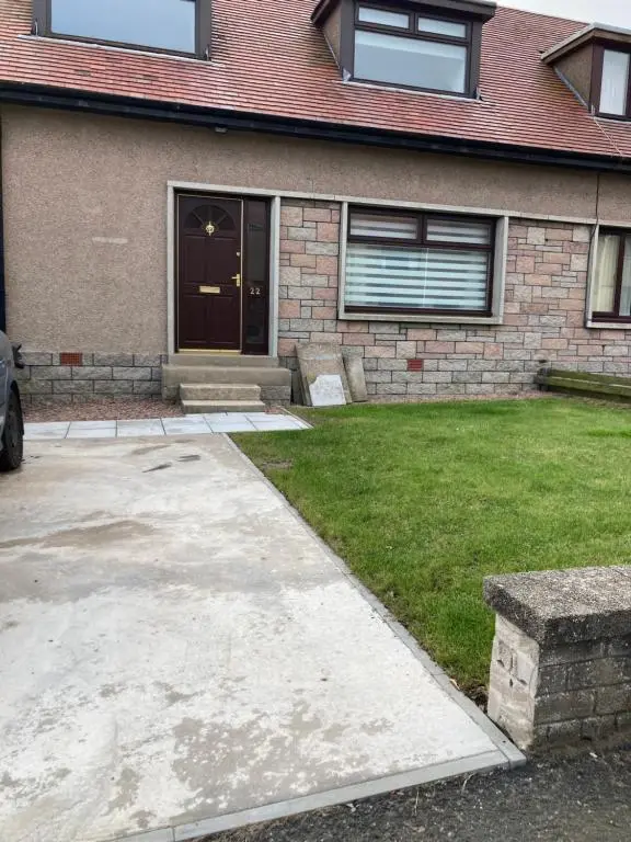 a house with a driveway leading to a door at No 22 in Banff
