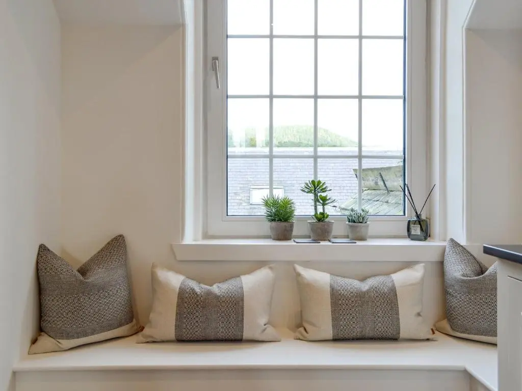 a row of pillows sitting on a window sill at Darroch View in Ballater