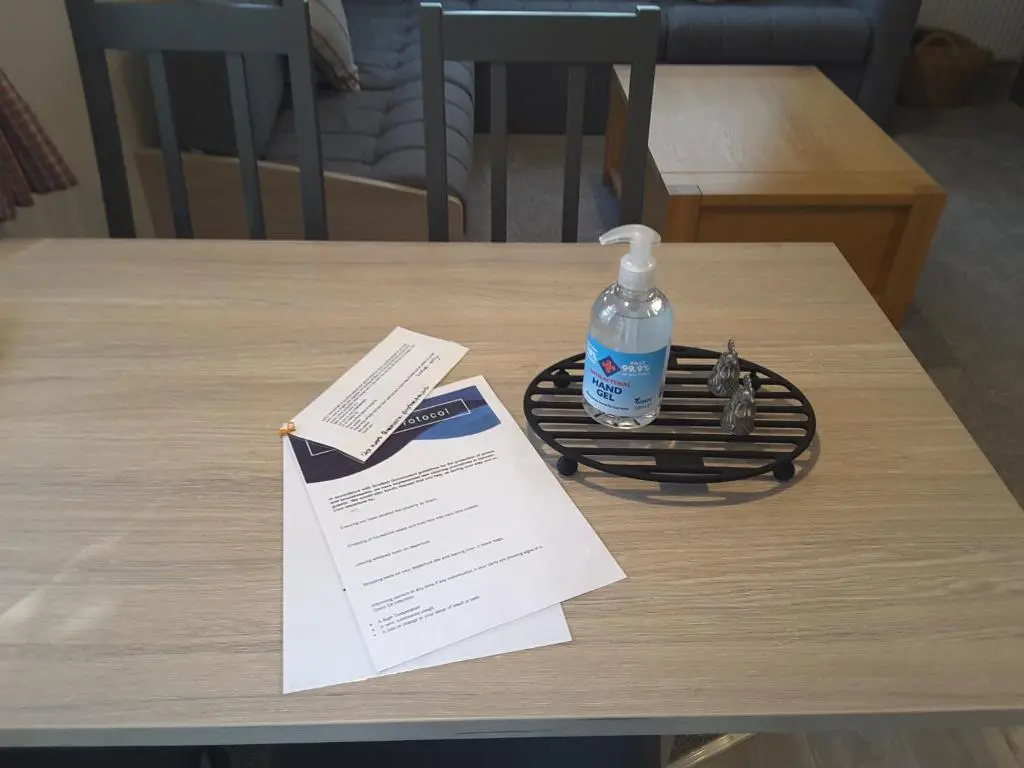 a bottle of water sitting on top of a table at No 46 Coorie-in in Boat of Garten