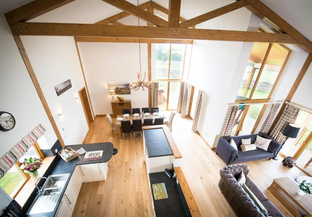 an overhead view of a living room with tables and chairs at Blue Sky Lodges. Atlas & Aurae in Croy