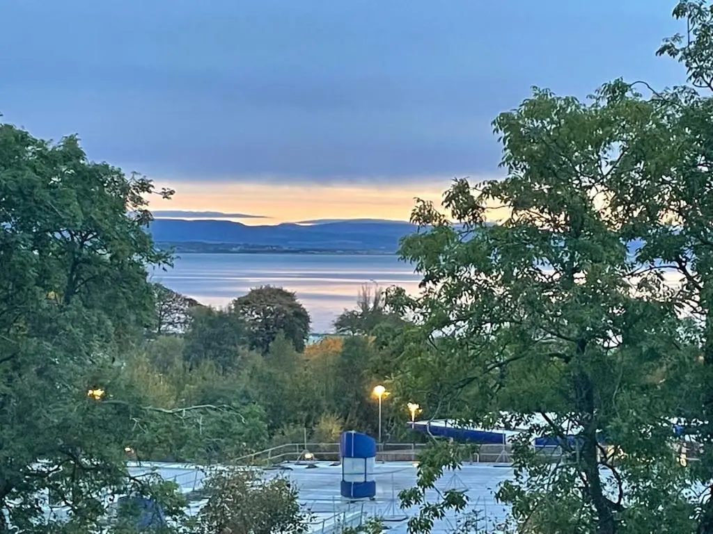 a view of a body of water with trees at Shandwick House in Tain