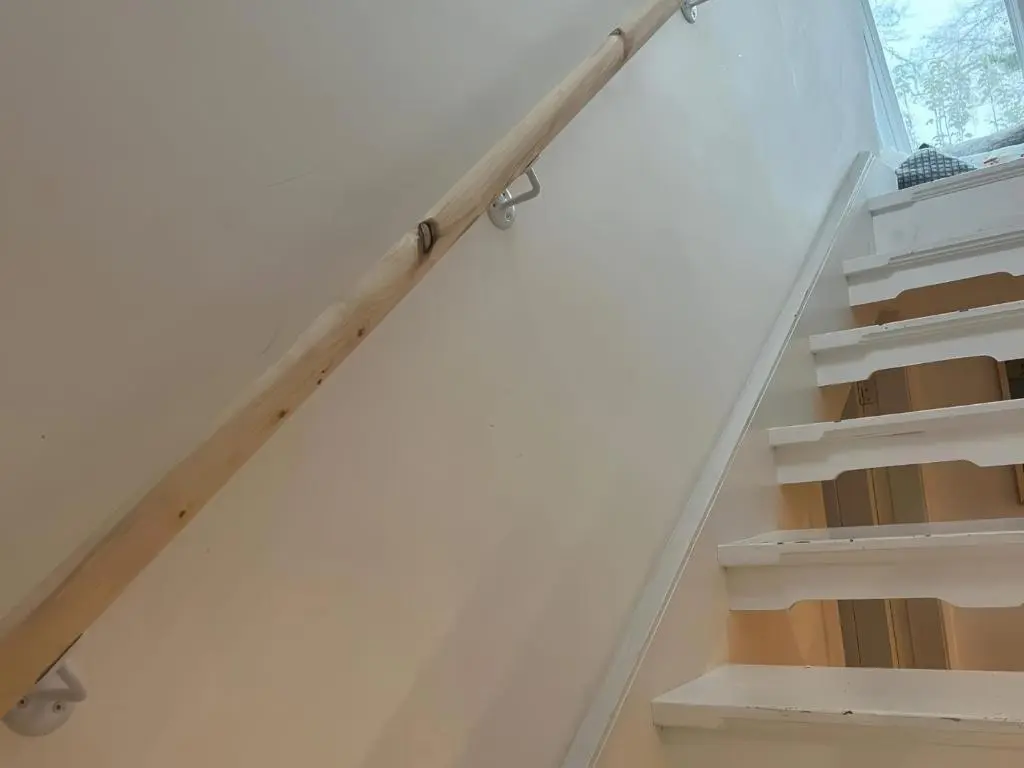 a stair railing in a room with a window at 3 Dunrobin Street in Tain