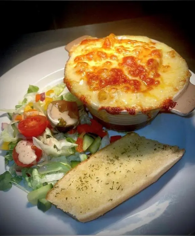 a plate of food with a salad and a quiche at The Aberlour Hotel in Aberlour