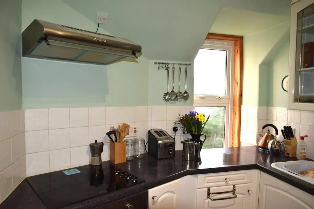 a kitchen with a counter top and a sink at The 'Fairy Hill' Apartment in Inverness