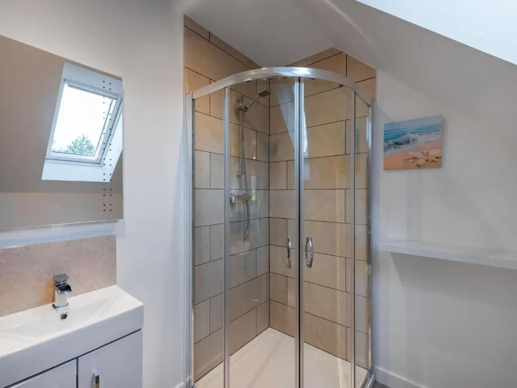 a shower with a glass door in a bathroom at Holiday Home Loch Ness House by Interhome in Drumnadrochit