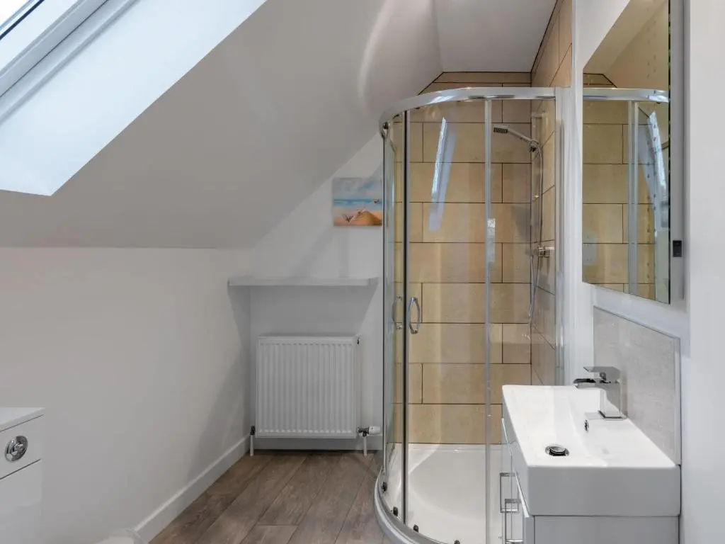 a bathroom with a sink and a mirror at Holiday Home Loch Ness House by Interhome in Drumnadrochit