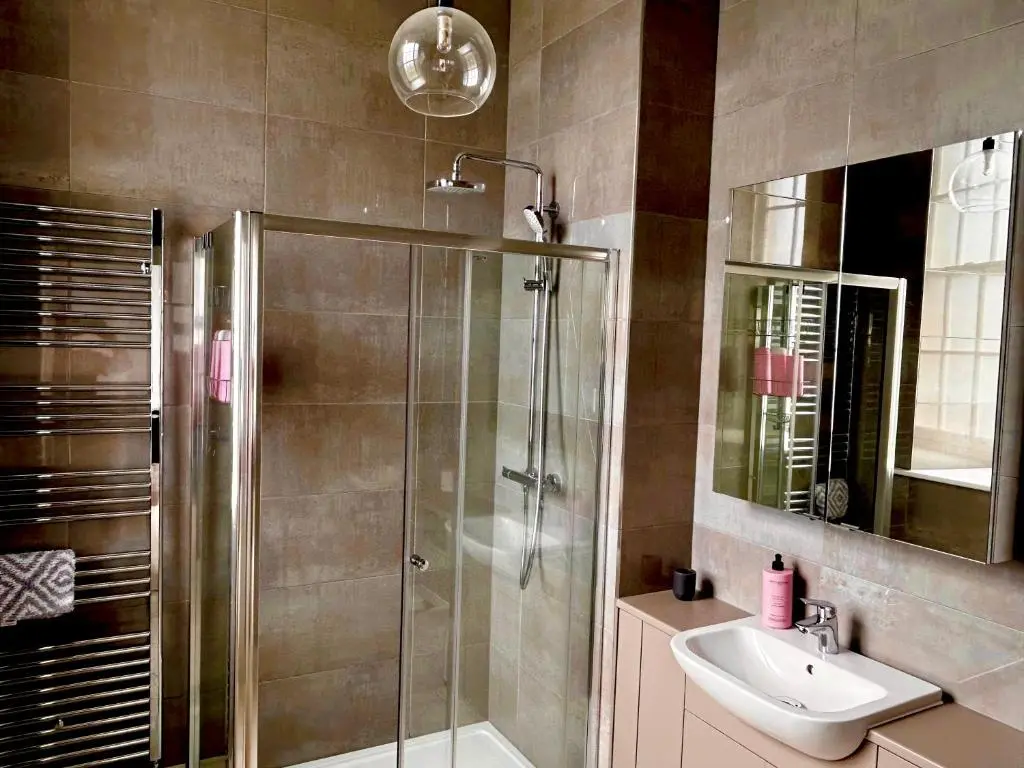 a bathroom with a shower and a sink at 38 Great Glen Townhouse Inverness in Inverness