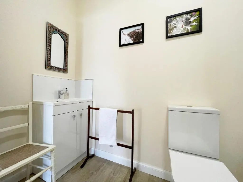 a bathroom with a sink and a mirror at Farr Out in Farr