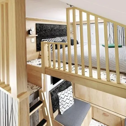 a room with a staircase with a bed in it at The Willy Gunn Pod - Beautiful, luxury pod in Aberlour
