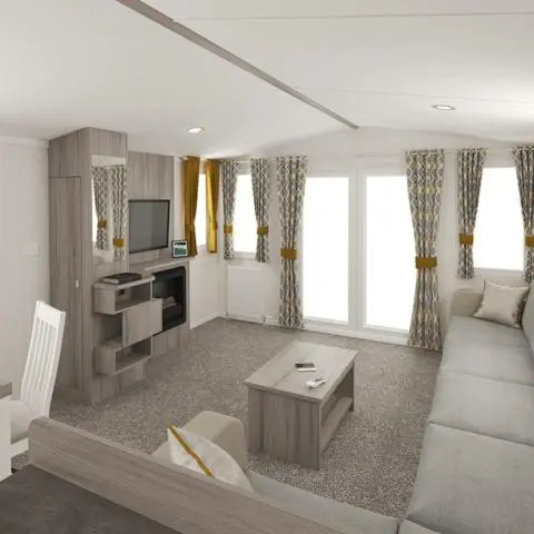 a living room with a couch and a tv at The Trout Van - Beautiful, luxury static caravan in Aberlour