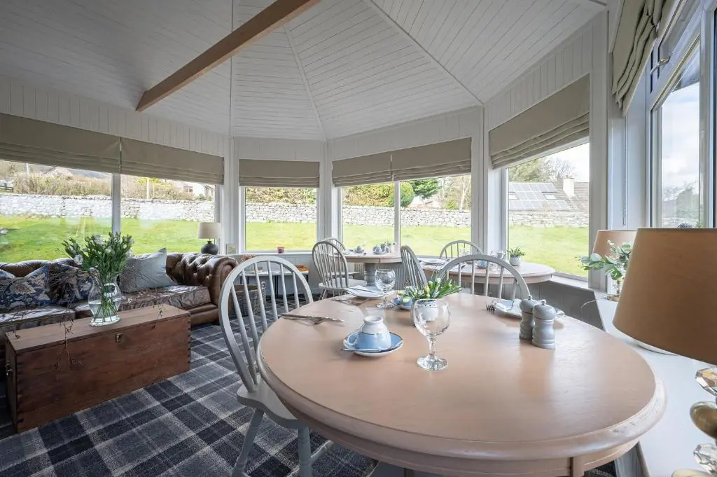 a dining room with a table and chairs at Balmridge House, Loch Ness, Bed & Breakfast in Drumnadrochit