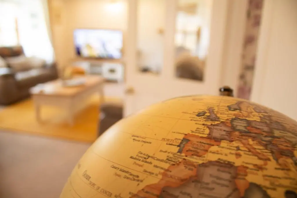 a close up of a globe in a living room at Longfield, Daviot in Inverness