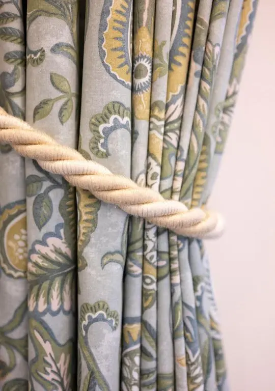a close up of a curtain with a rope at The Hideaway in Inverness