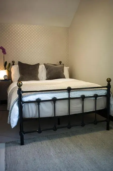 a bedroom with a bed in a room at The Presbytery, Forres in Forres