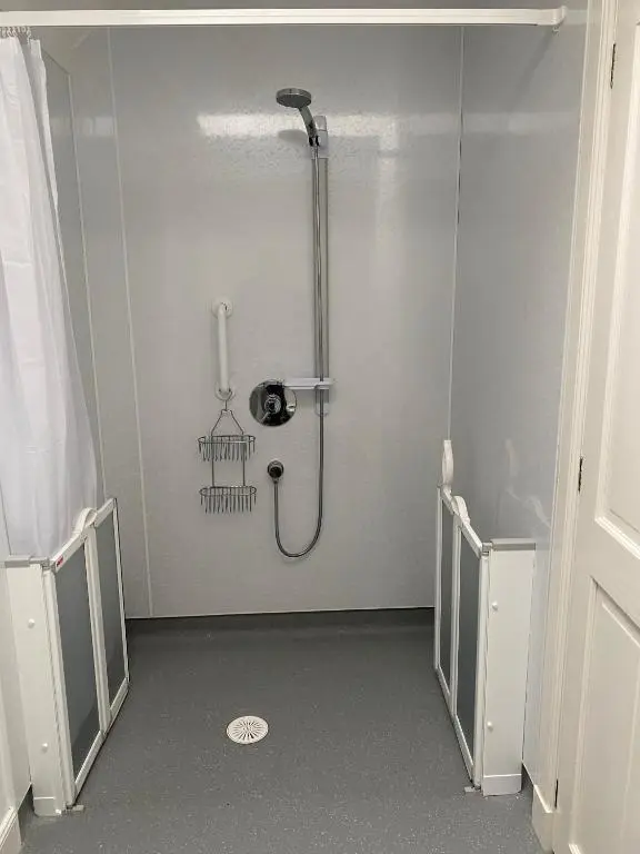 a shower stall in a bathroom with a shower at Cosy Cottage in beautiful Royal Deeside in Aboyne